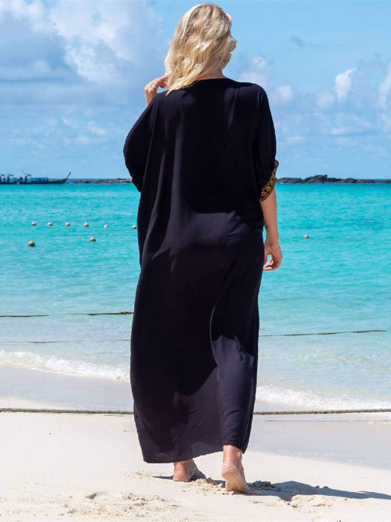 Elegant retro strandkjole med V-utringning