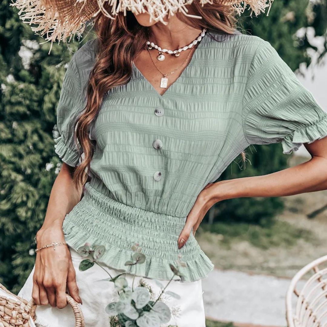 Plissert bluse med knappefront og peplum
