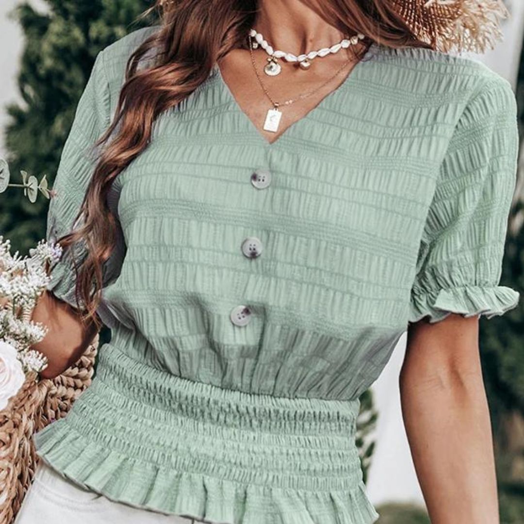 Plissert bluse med knappefront og peplum