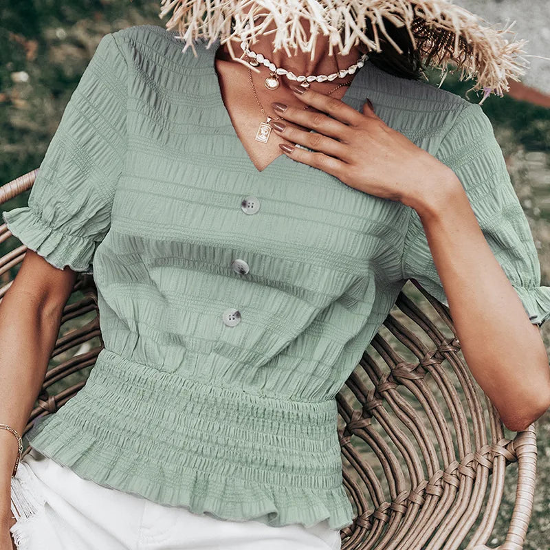 Plissert bluse med knappefront og peplum