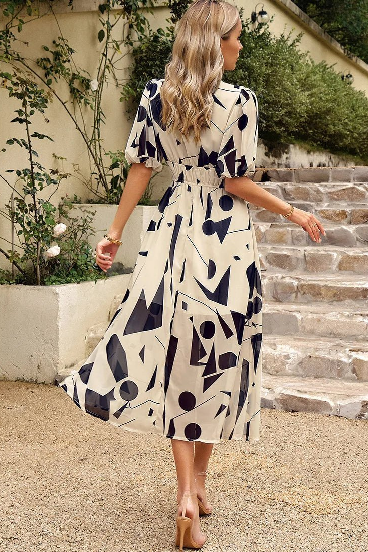 Blossom | Midikjole i chiffon med blomstermønster og puffermer
