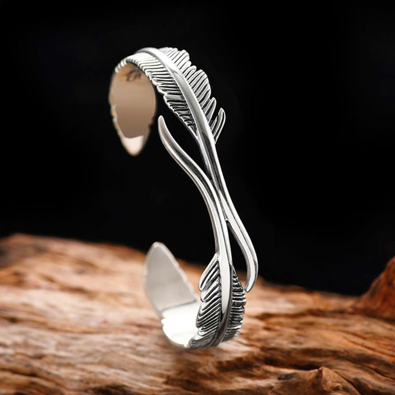 Mansjettarmbånd med gjennombrutt fjærdesign i sterling