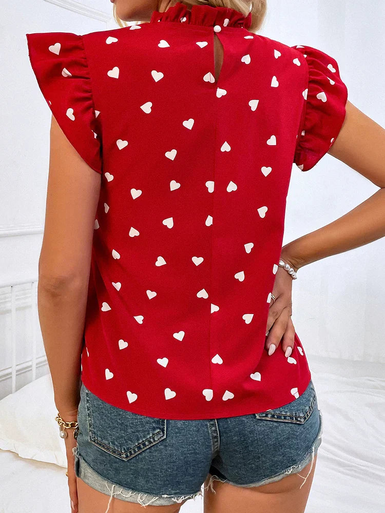 Chiffonbluse med volanger og korte ermer