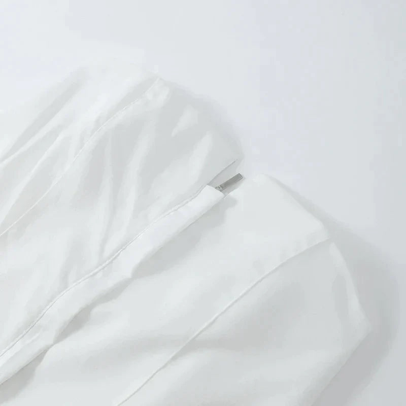Strukturert, stroppeløs topp med peplum