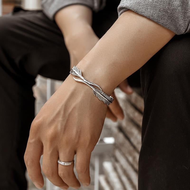 Mansjettarmbånd med gjennombrutt fjærdesign i sterling