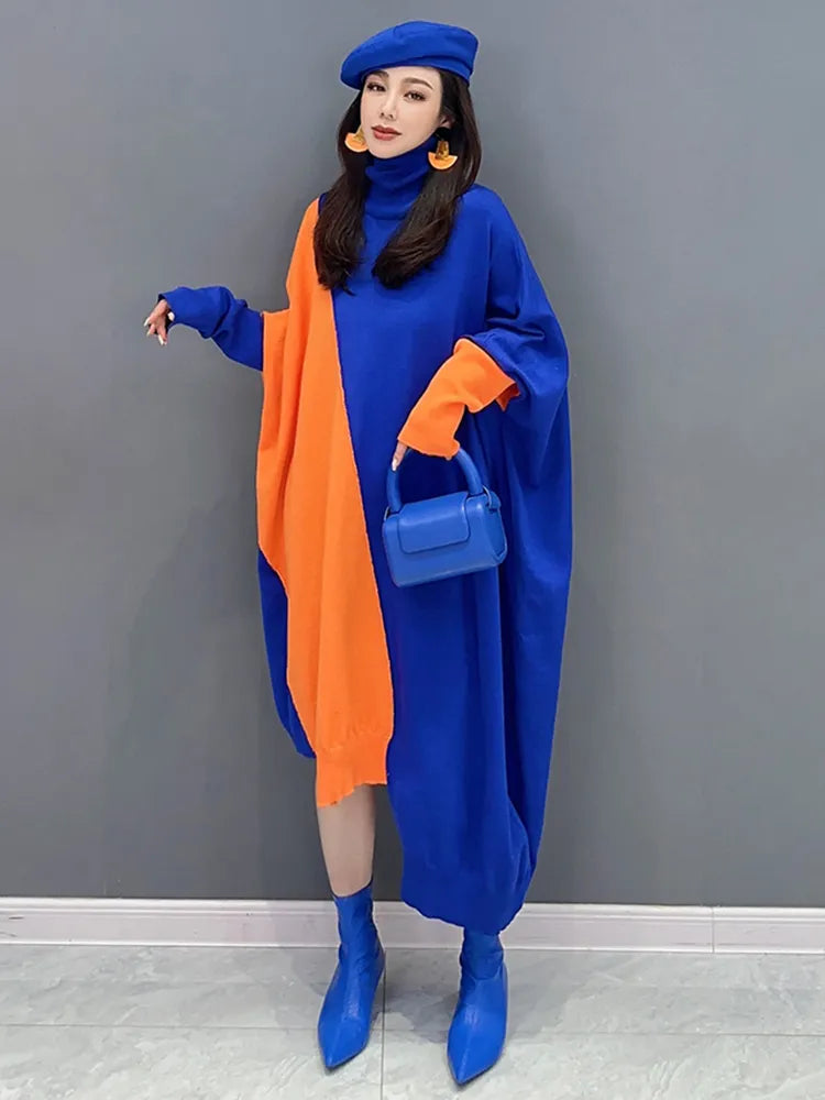 Ujevn eleganse: Oversized høyhalset batwing-strikkekjole
