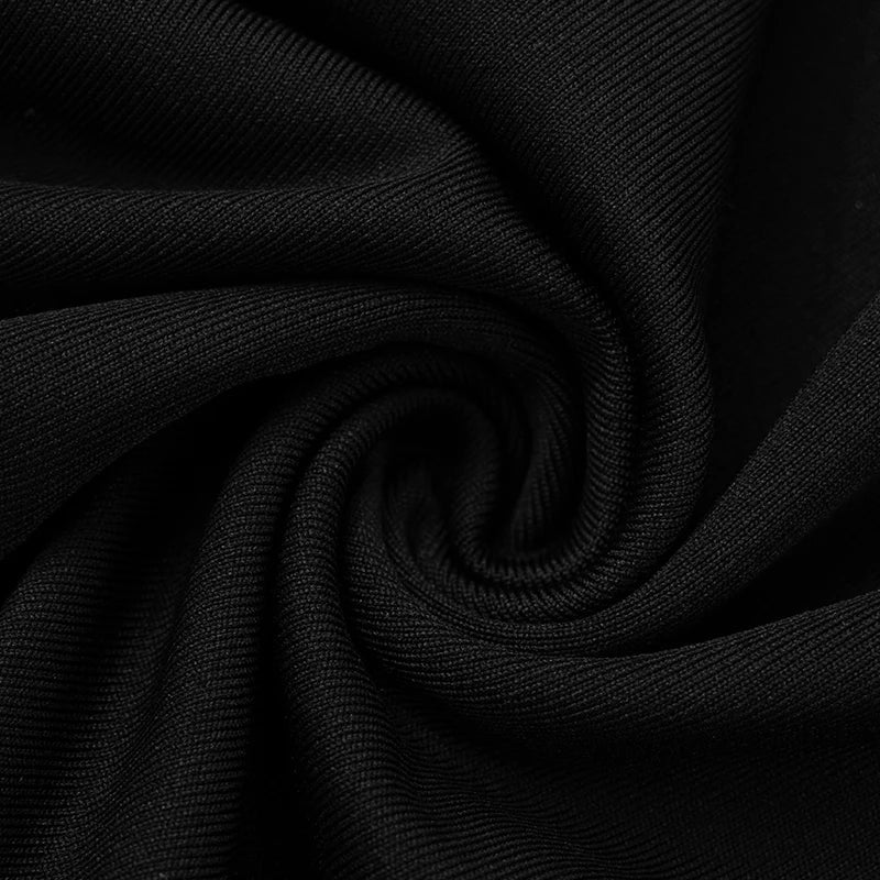 Monokrom jumpsuit med halterneck og sløyfe som aksent