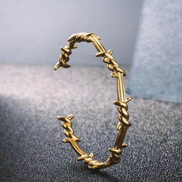 Mansjettarmbånd med gjennombrutt fjærdesign i sterling