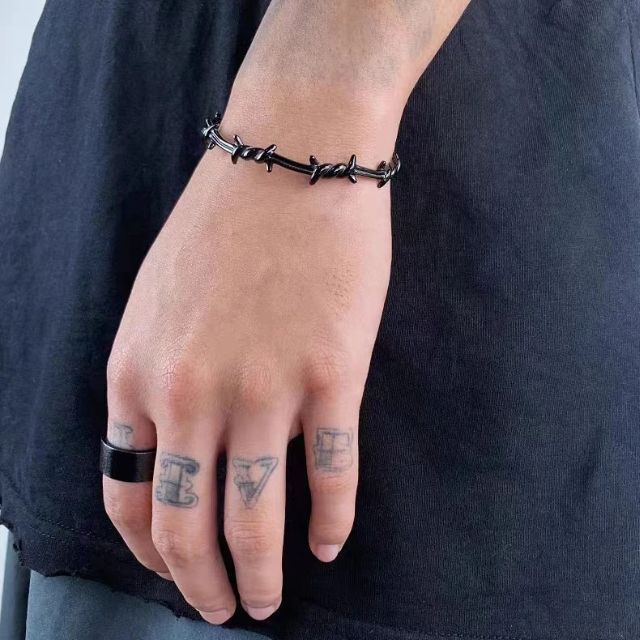 Mansjettarmbånd med gjennombrutt fjærdesign i sterling