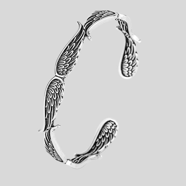 Mansjettarmbånd med gjennombrutt fjærdesign i sterling