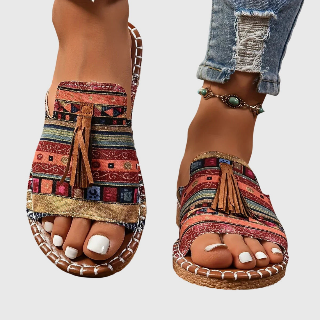 Zuri | Flate slip-in-sandaler i lerret med bohemsk mønster og dusk