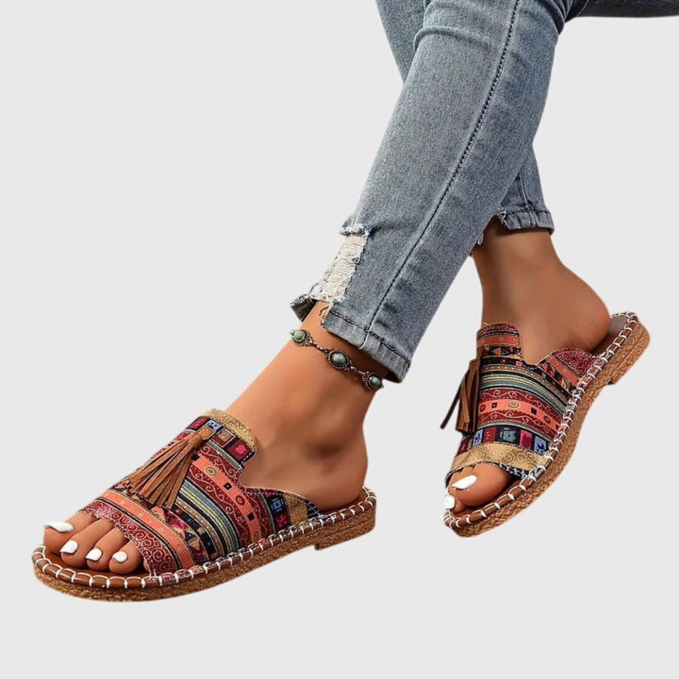Zuri | Flate slip-in-sandaler i lerret med bohemsk mønster og dusk