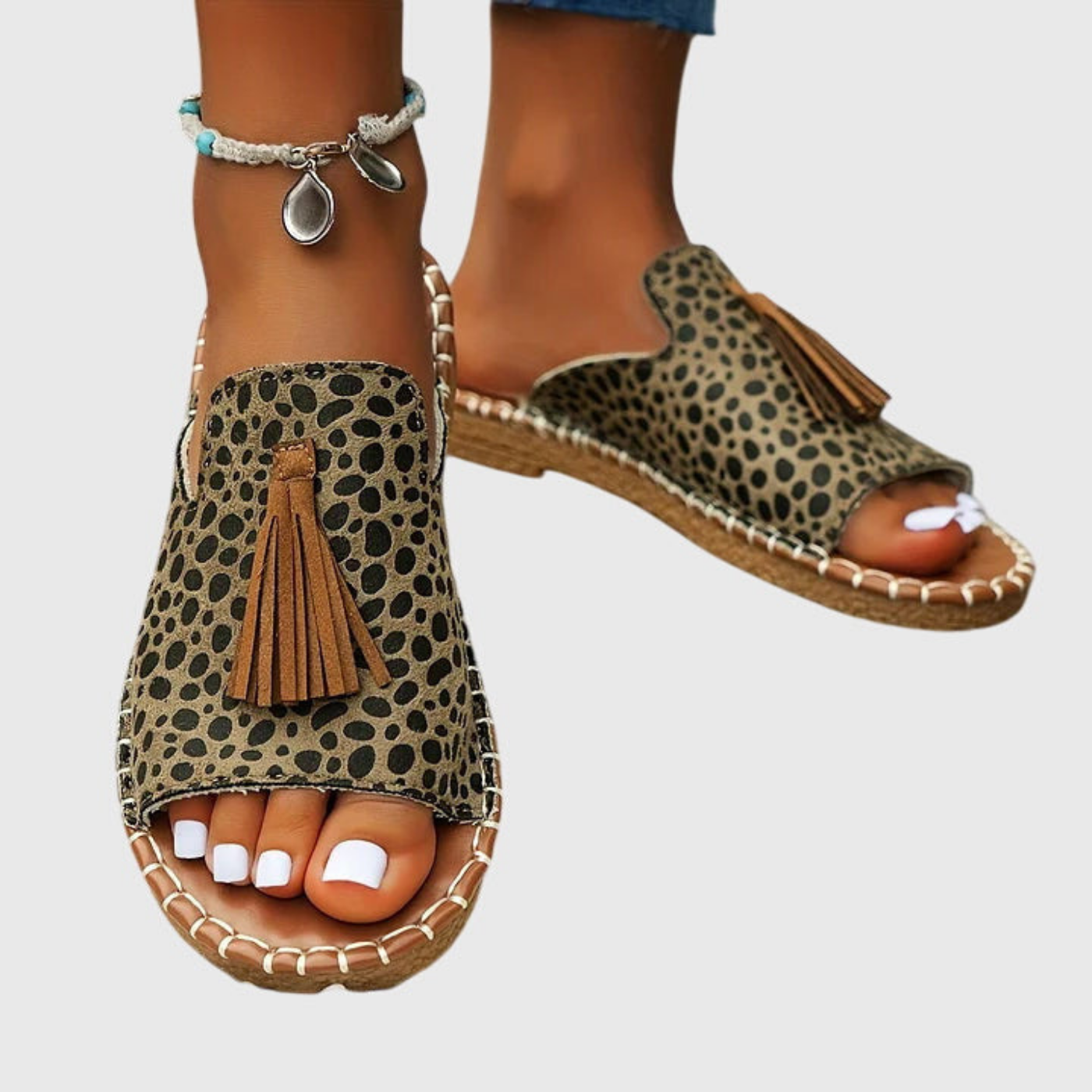 Zuri | Flate slip-in-sandaler i lerret med bohemsk mønster og dusk