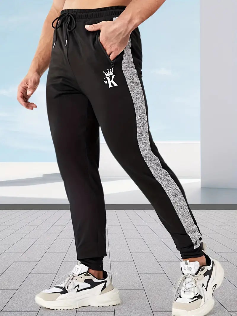 Stripete joggebukse med høy stretch og grafisk design med kronet K
