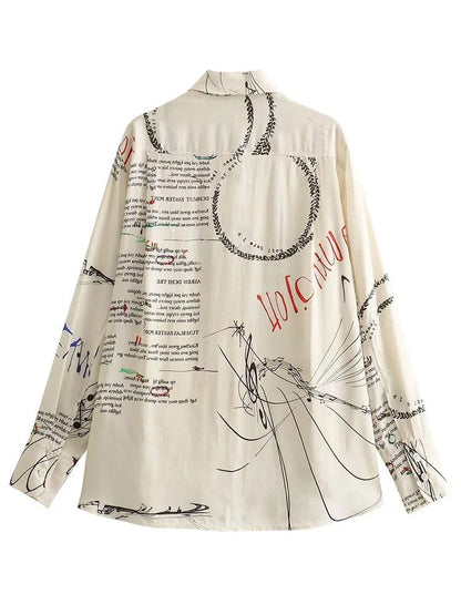 Trykt bluse med asymmetrisk snitt