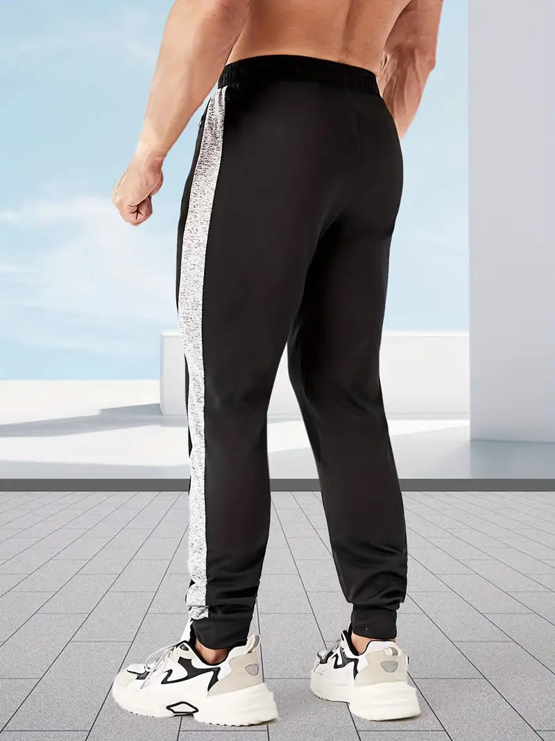 Stripete joggebukse med høy stretch og grafisk design med kronet K