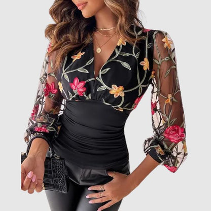 Bluse med broderte, gjennomsiktige ermer
