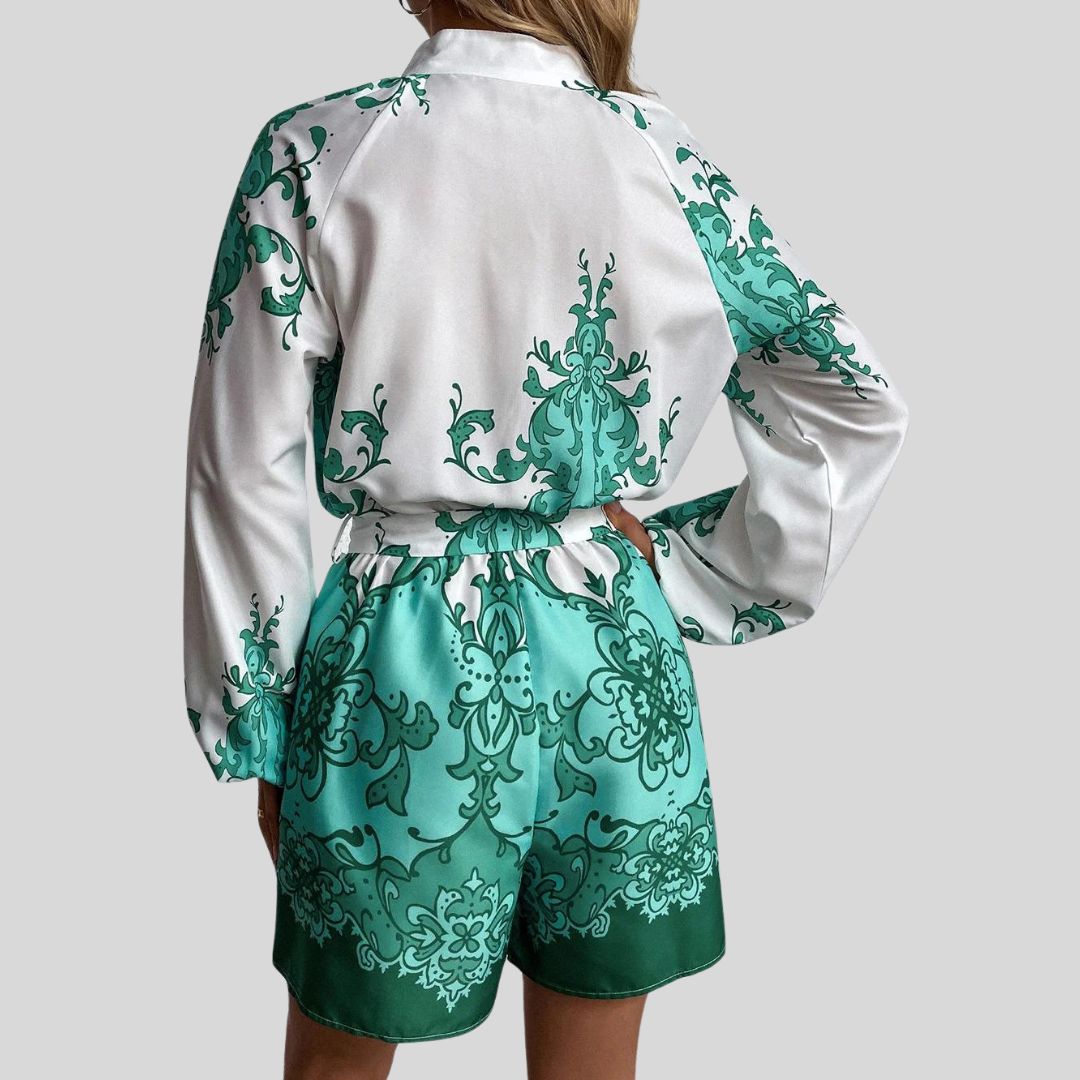 Elegant playsuit med blomstertrykk og linning