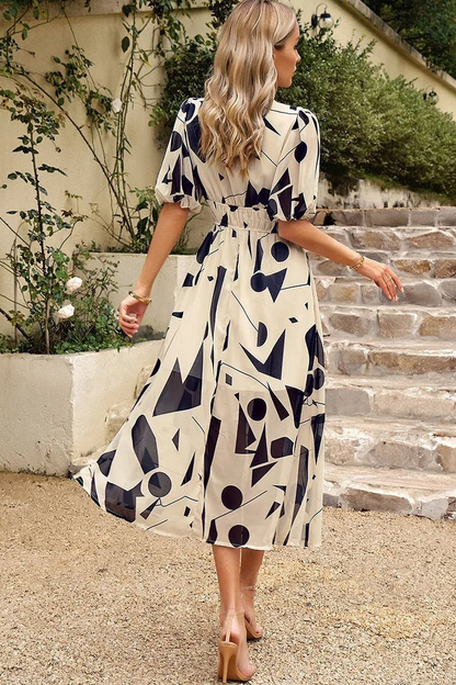 Blossom | Midikjole i chiffon med blomstermønster og puffermer