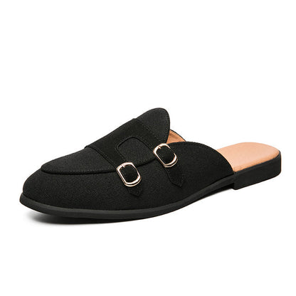 Moderne mules med spenner i tofarget look