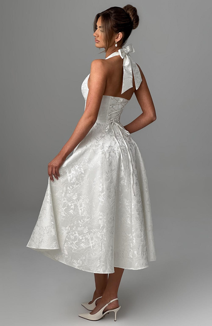 Celestine | A-formet midikjole i jacquard med dyp V-halterneck