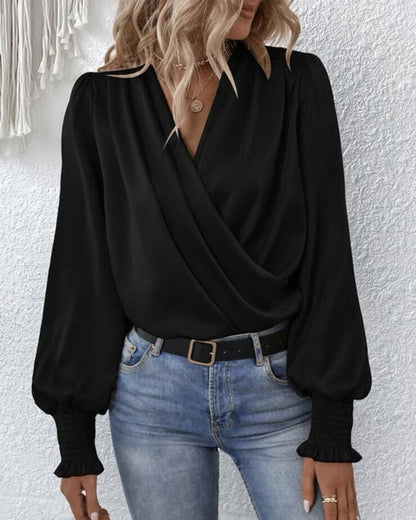 Elegant langermet omslagsbluse