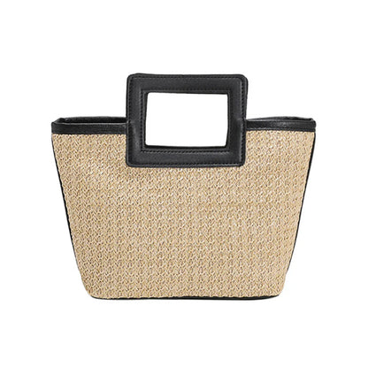 Elegant clutch med tekstur og iøynefallende håndtak