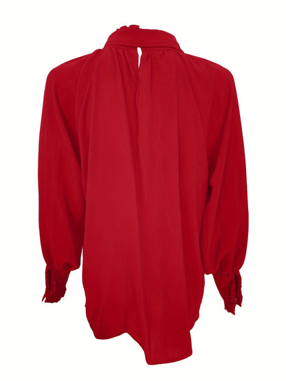 Bluse med lange ermer og knytning i halsen
