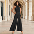 Liora | Plissert buksedress i chiffon med halterneck, knyteliv og vide ben – Svart
