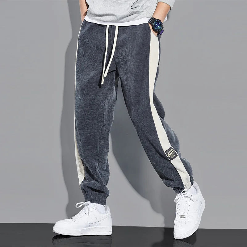 Joggers i vintage kordfløyel med kontrastfargede striper