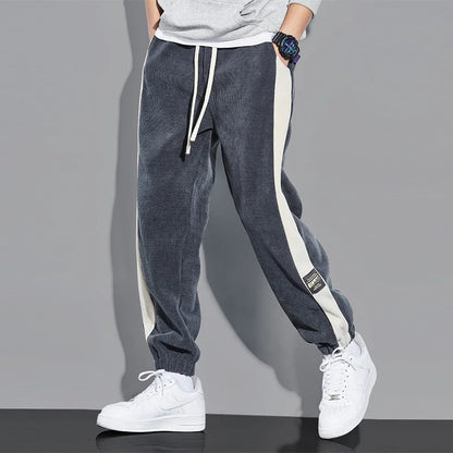 Joggers i vintage kordfløyel med kontrastfargede striper