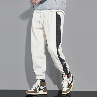 Joggers i vintage kordfløyel med kontrastfargede striper