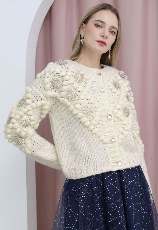 Paillettblomstret pom-pom strikkejakke
