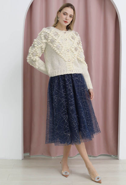 Paillettblomstret pom-pom strikkejakke