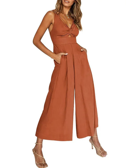 Elegant ermeløs jumpsuit med vide ben