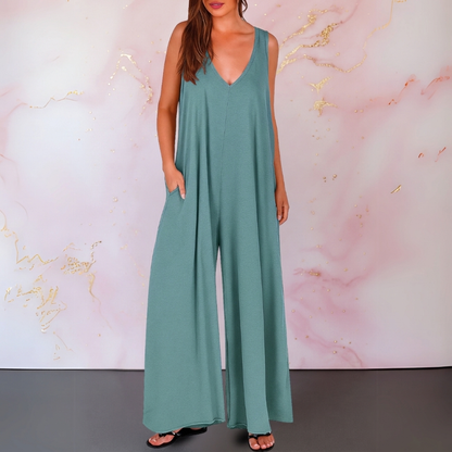 Zola | Elastisk ermeløs buksedress med V-hals og vide ben