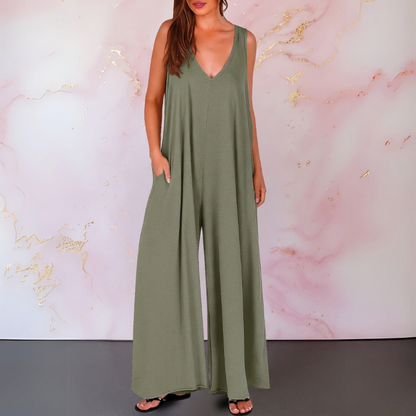 Zola | Elastisk ermeløs buksedress med V-hals og vide ben