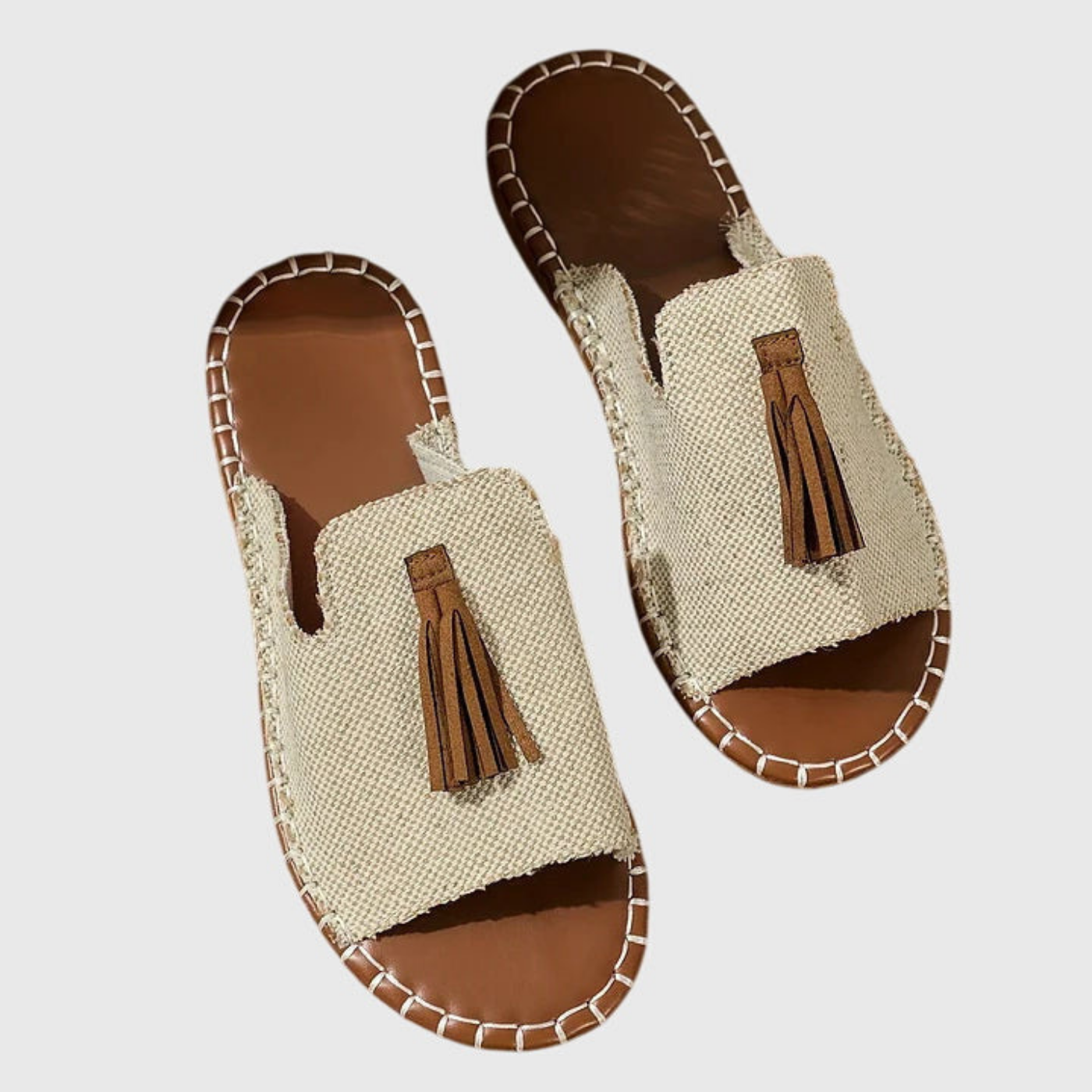 Zuri | Flate slip-in-sandaler i lerret med bohemsk mønster og dusk